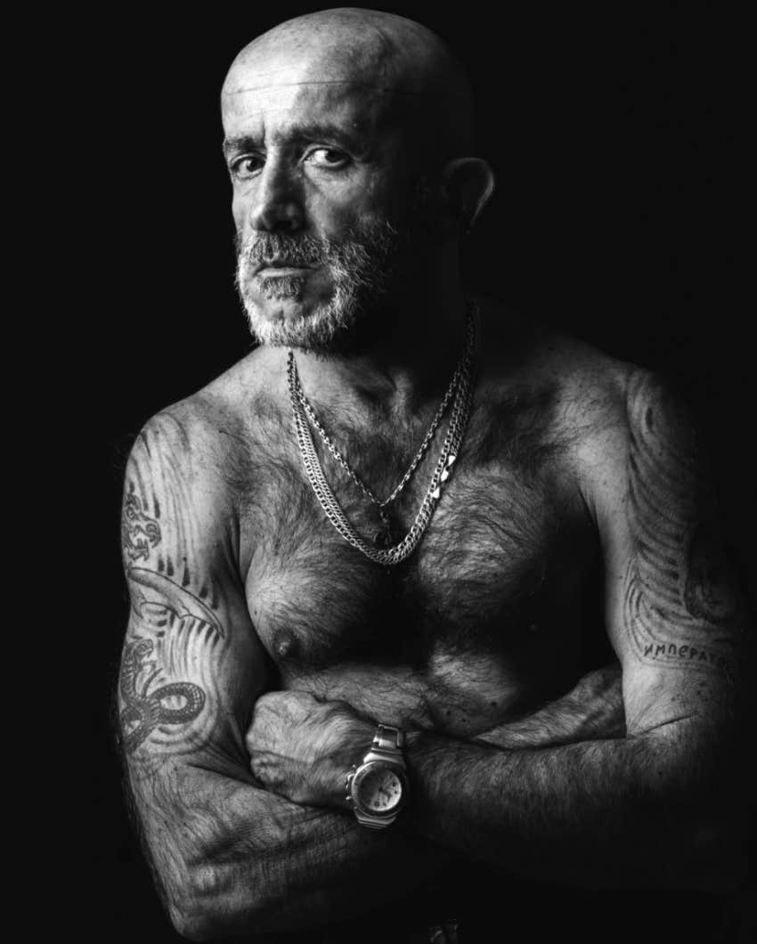 older man with arm tattoos