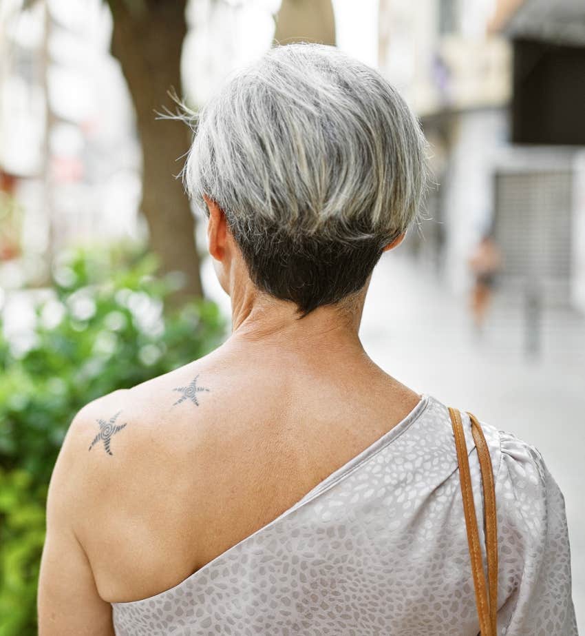 older woman with stars tattooed on her shoulder