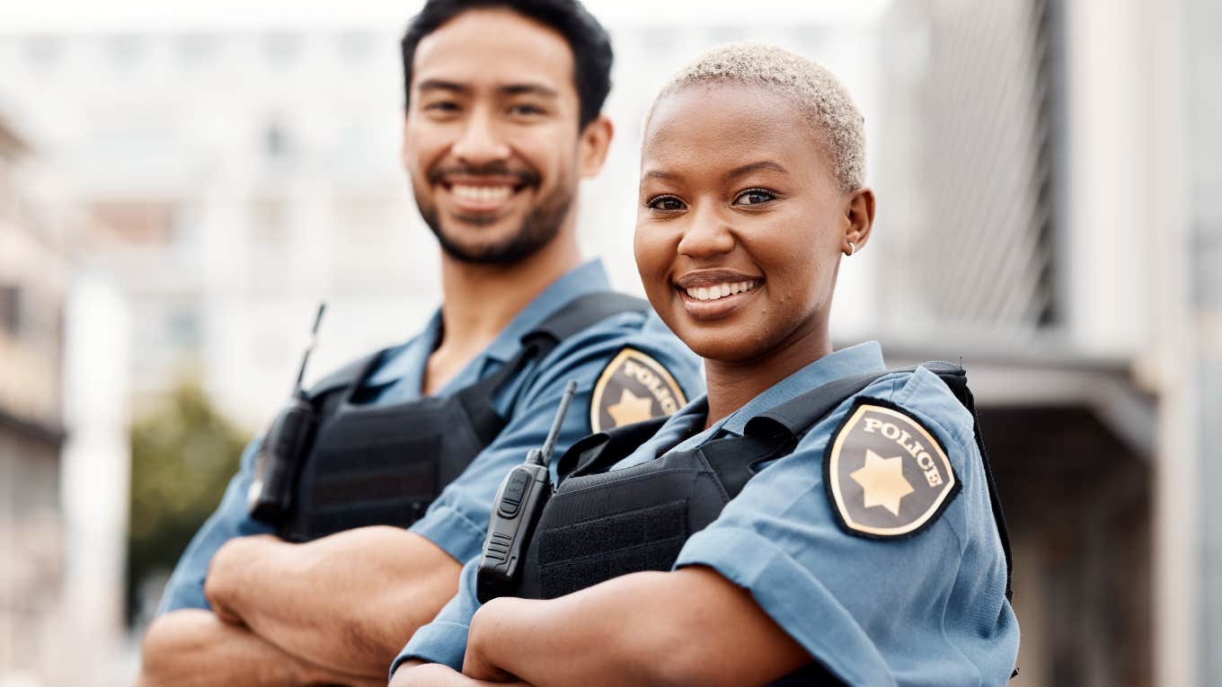 two smiling police officers