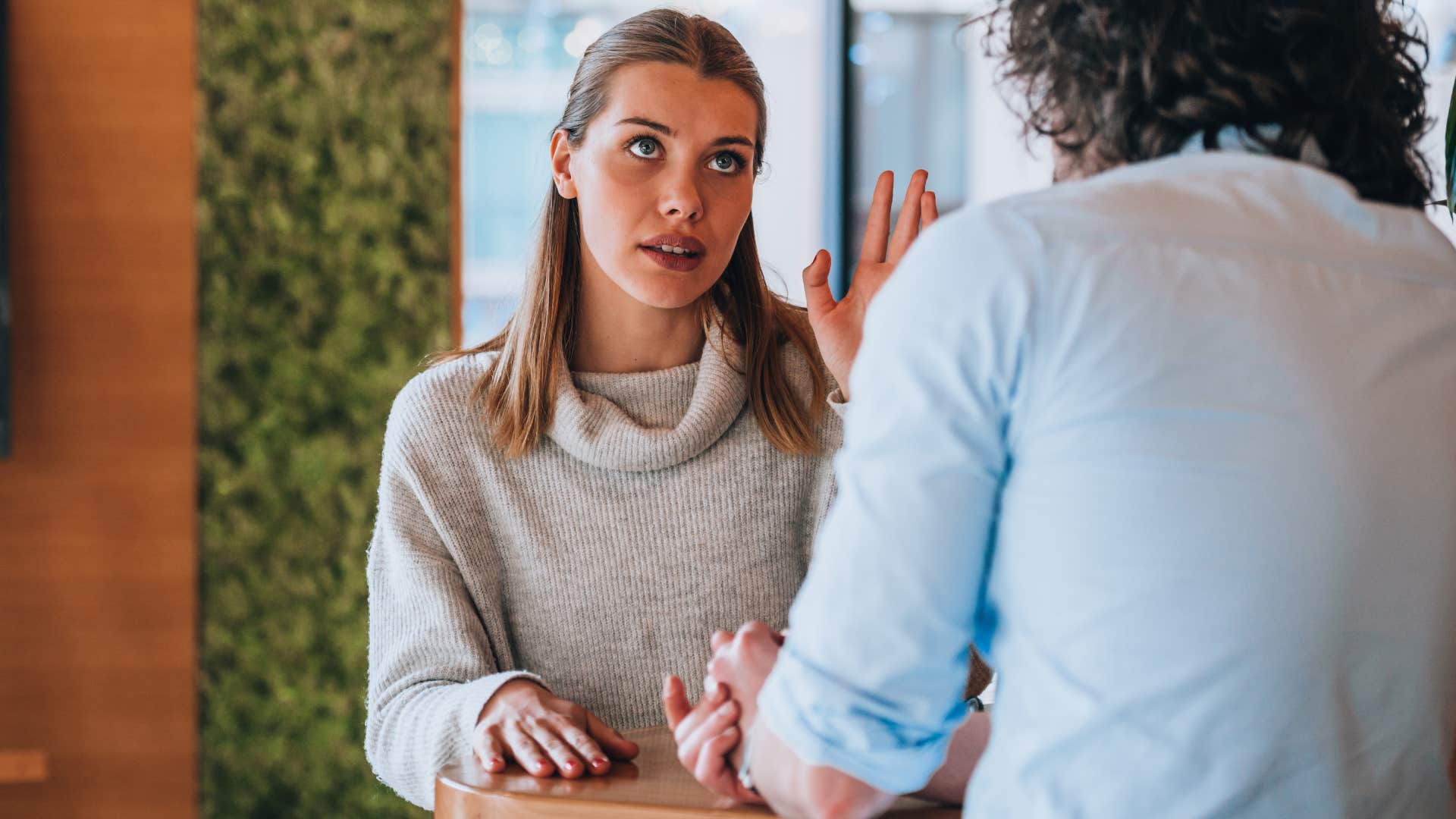 Woman talking to a man in public. 