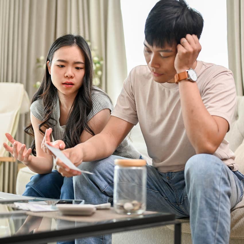 Two parents looking stressed over their nanny bills. 