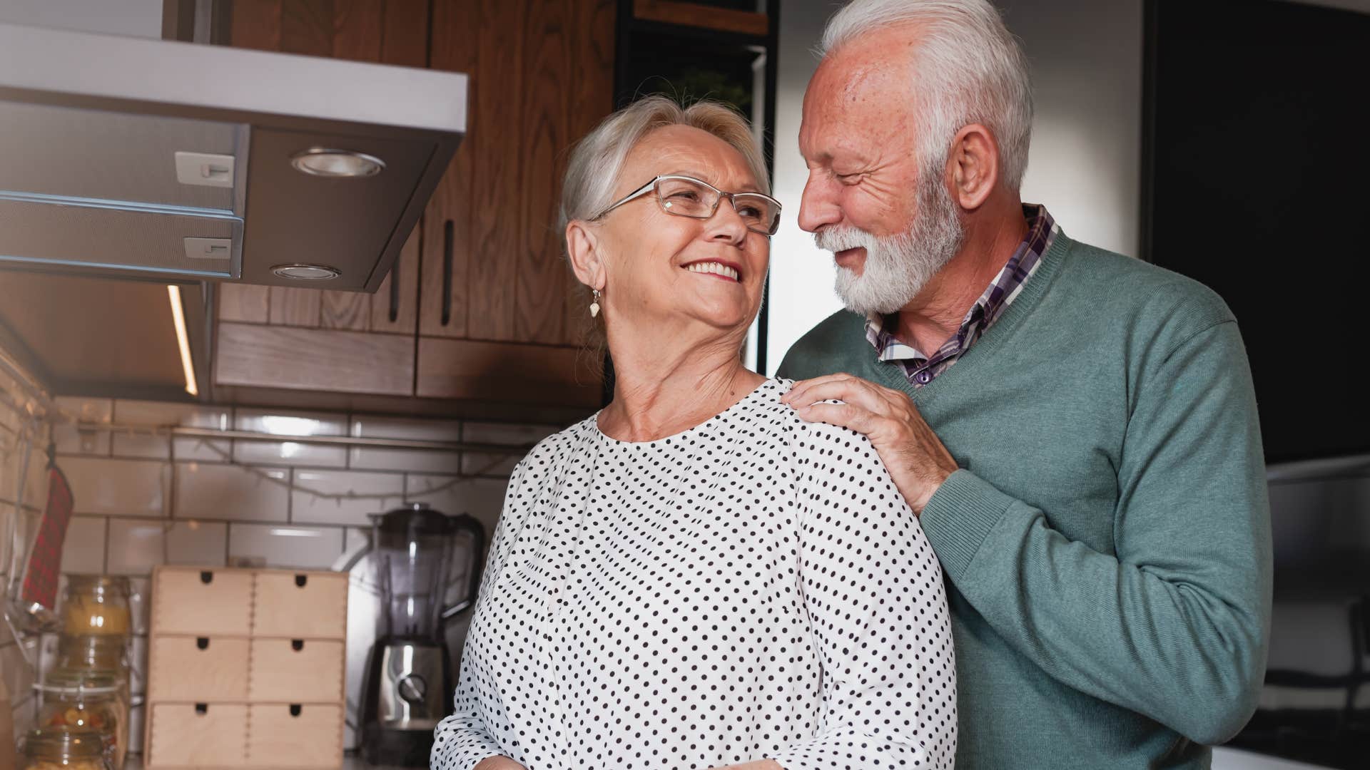 Adult couple making coffee together.