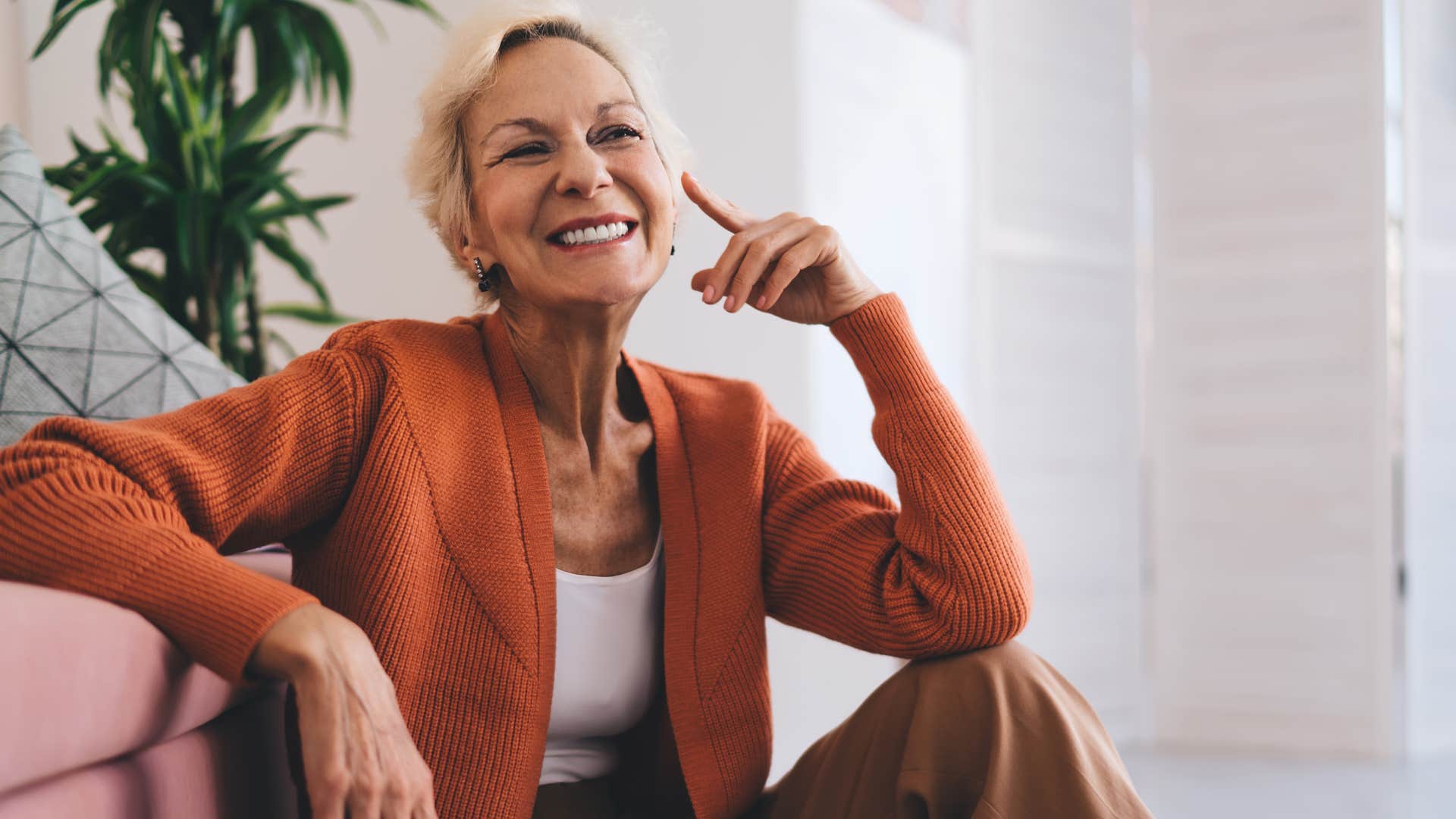 Older woman smiling confidently at home. 