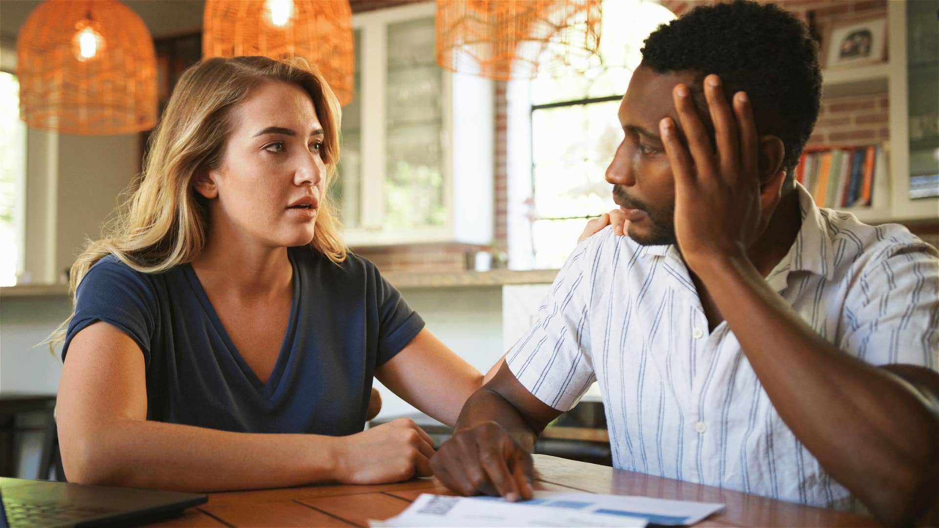 Couple has serious discussion sitting at a table