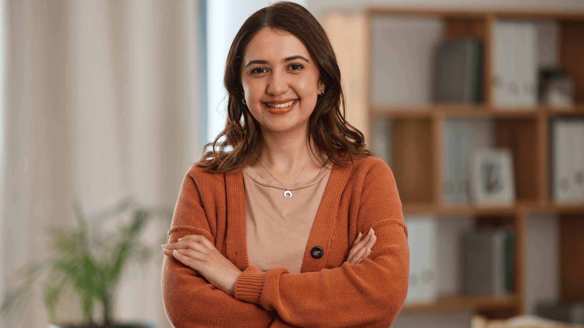 woman smiling and crossing arms 