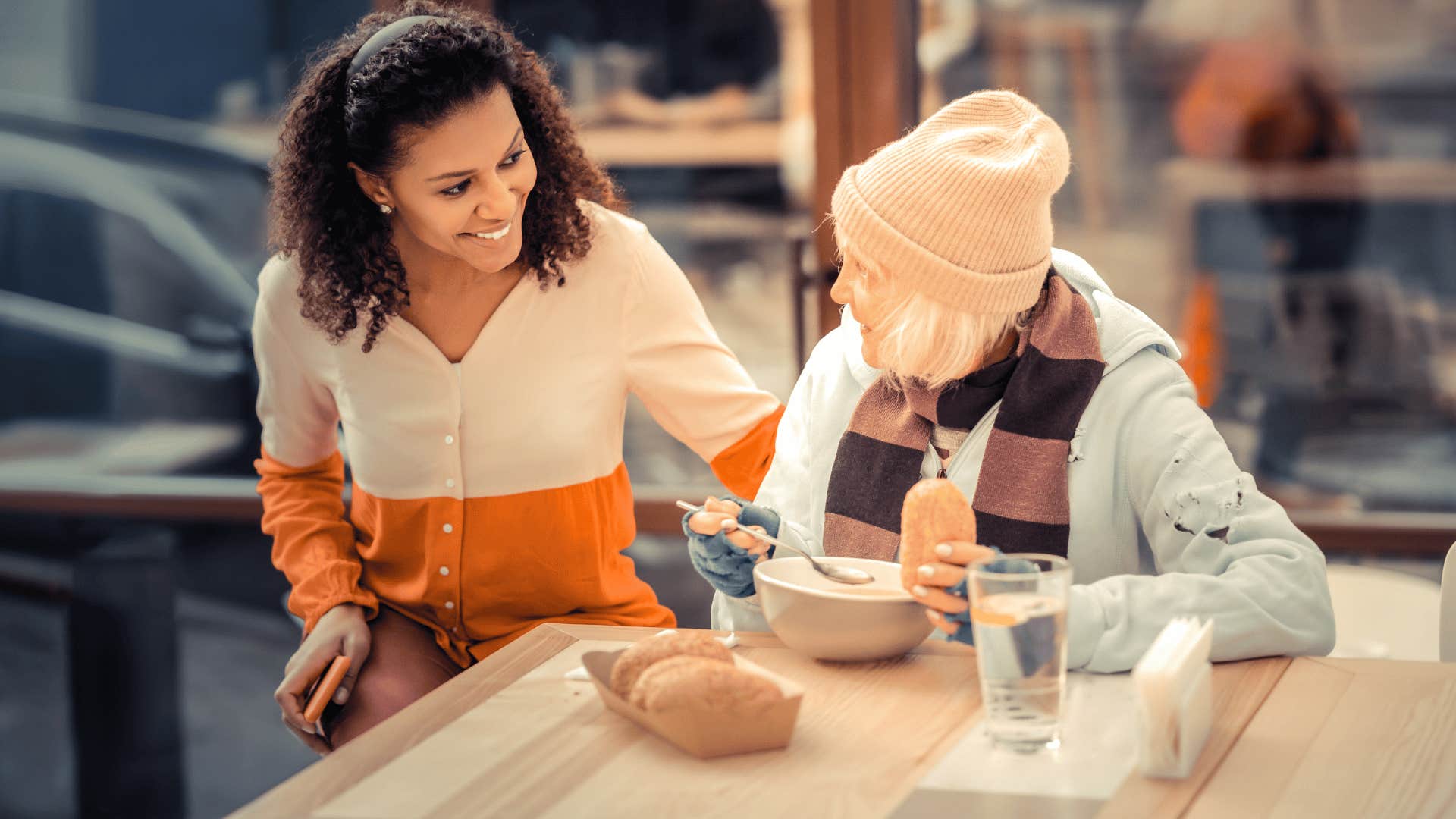 woman helping older woman