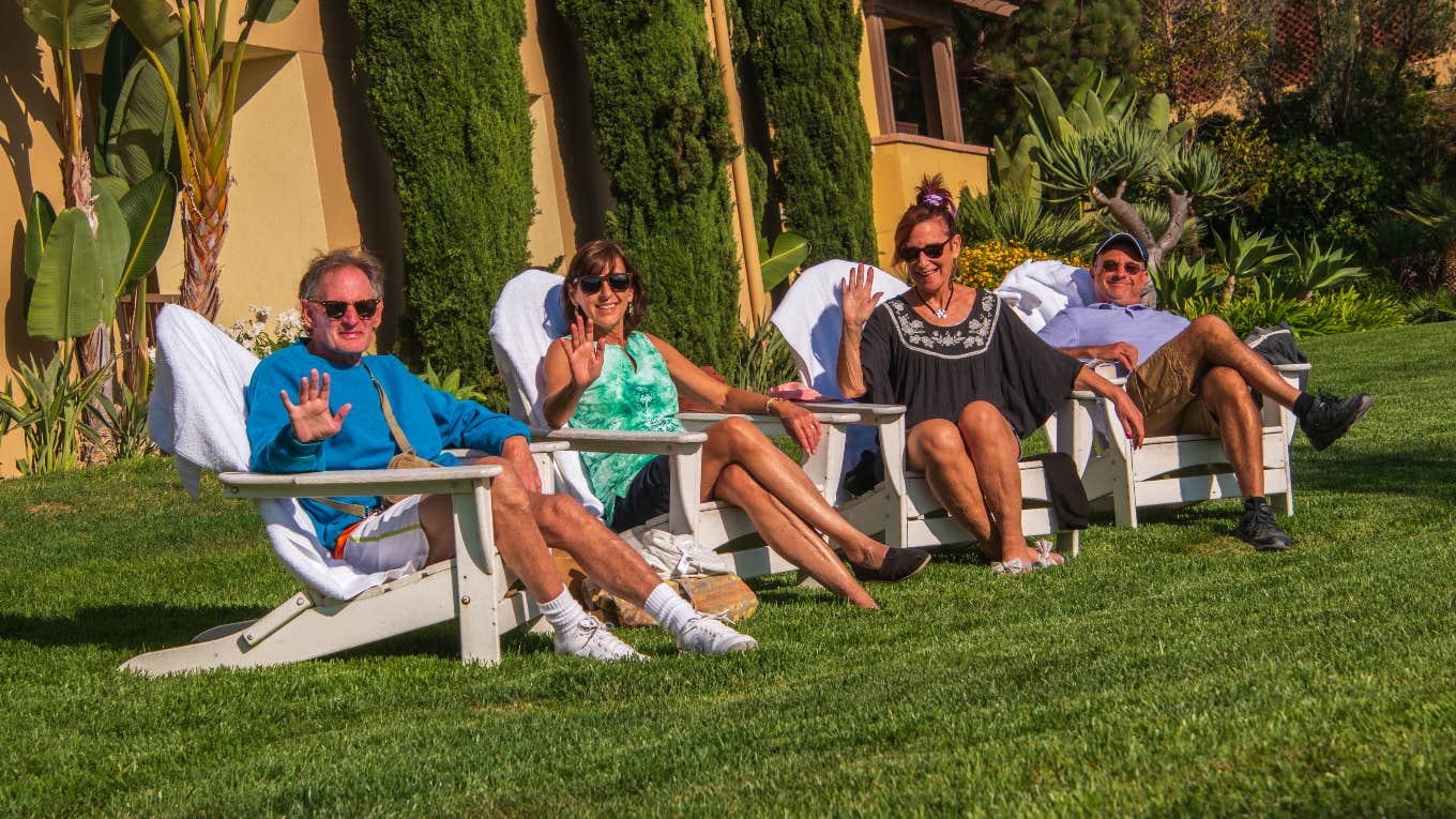 People sitting Adirondack chairs