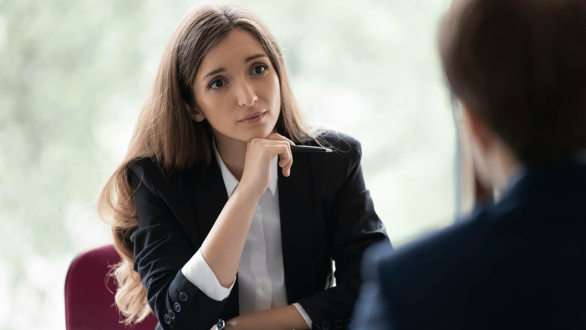 woman looking empathetically at arrogant person before putting him in his place