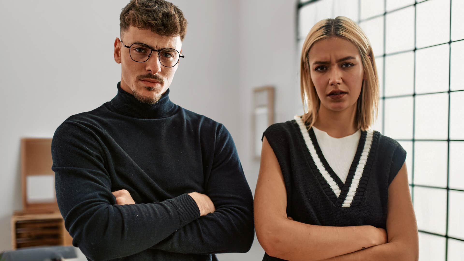 Two bosses looking upset in an office.