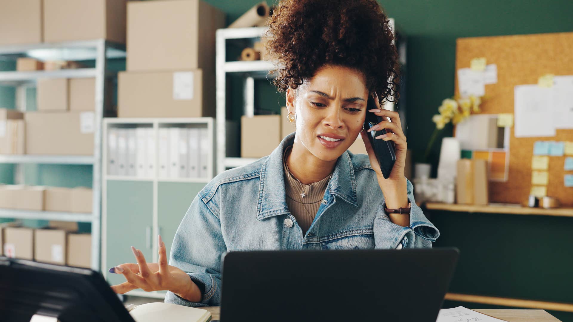 Woman looking annoyed while on her phone. 