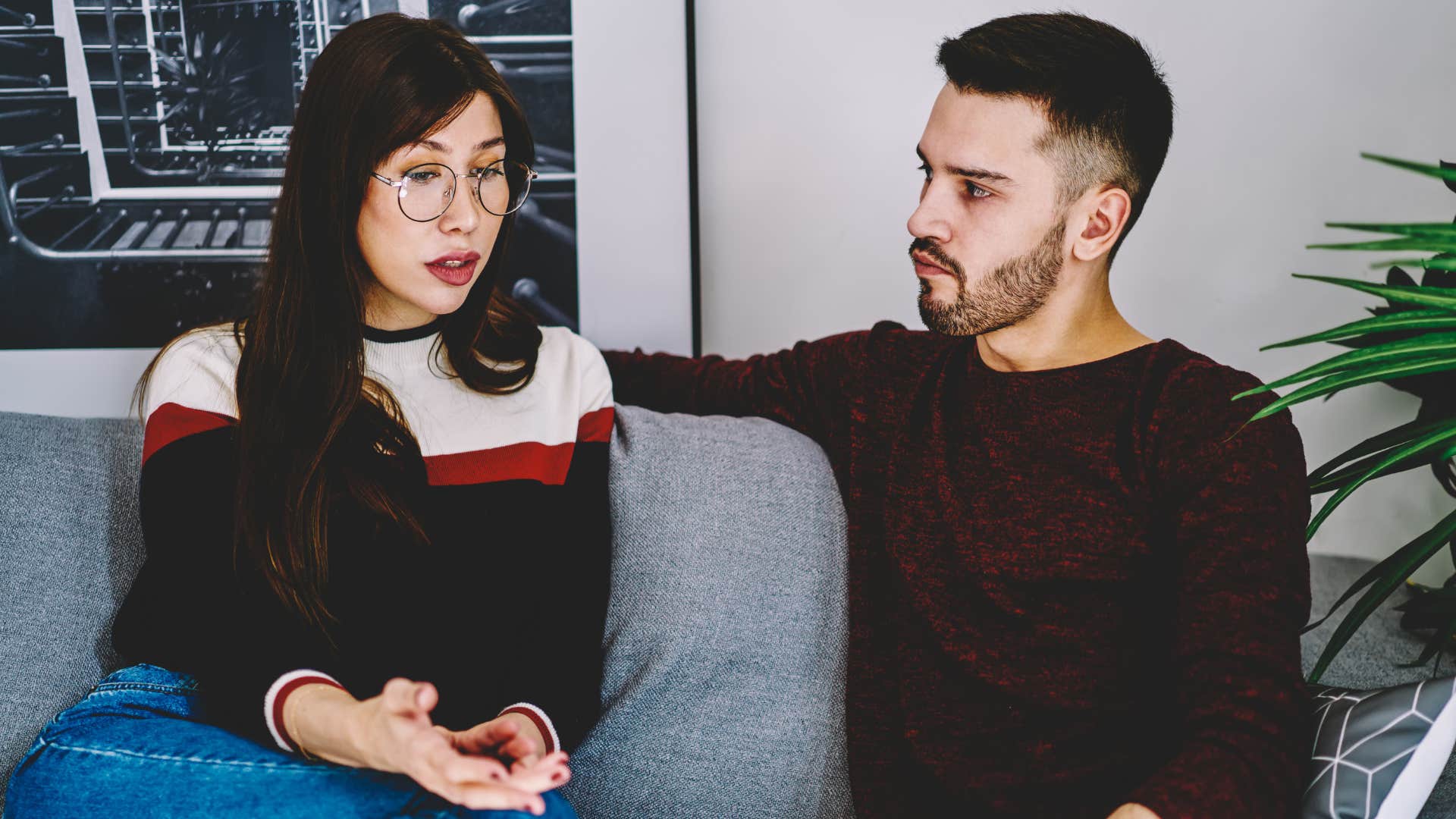 Couple having a calm argument on the couch