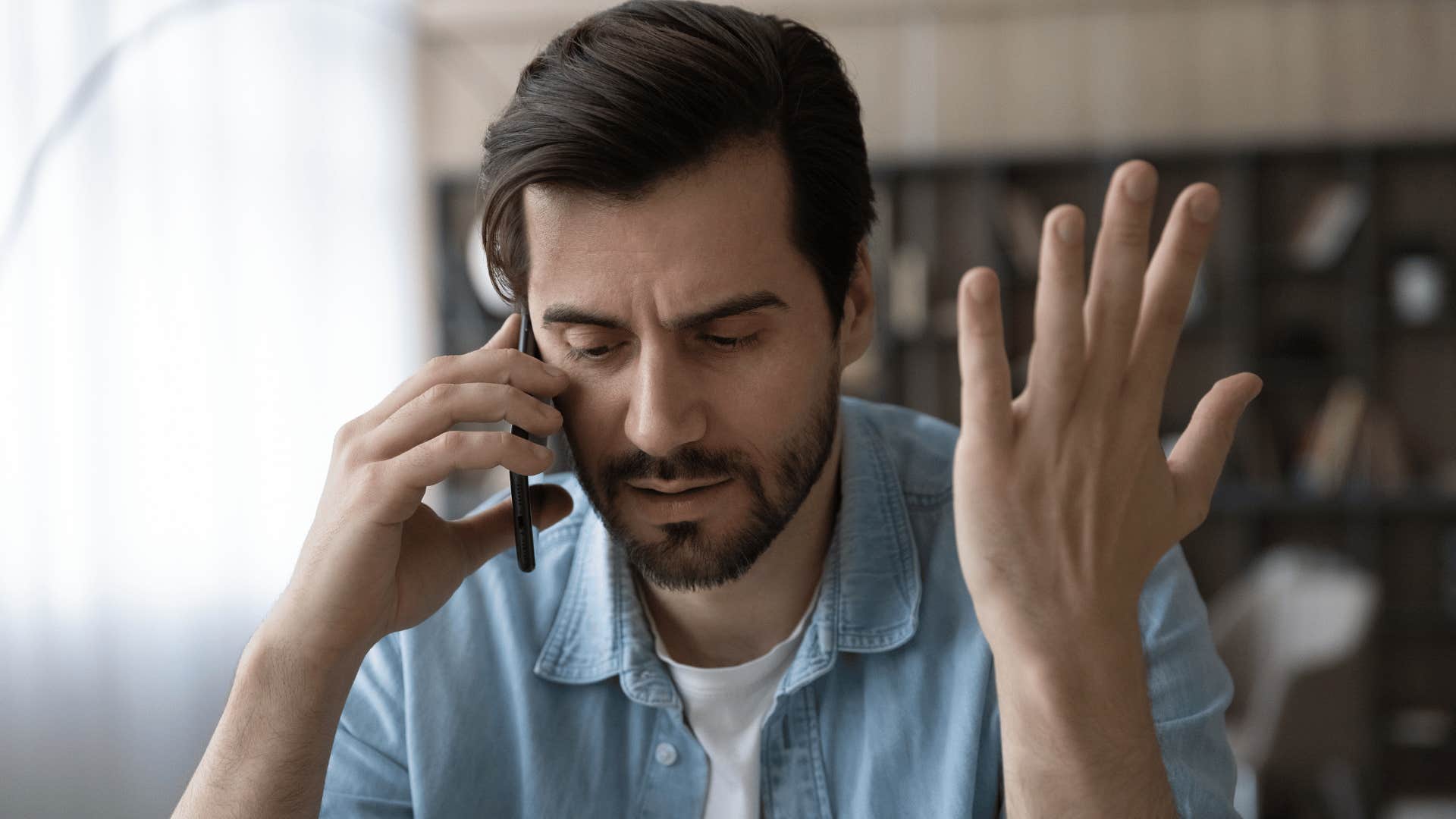 man yelling on the phone