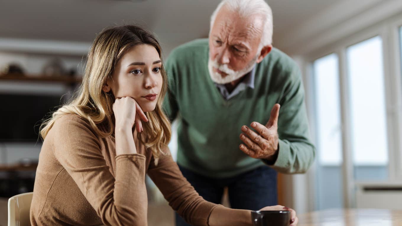 senior father scolding adult daughter