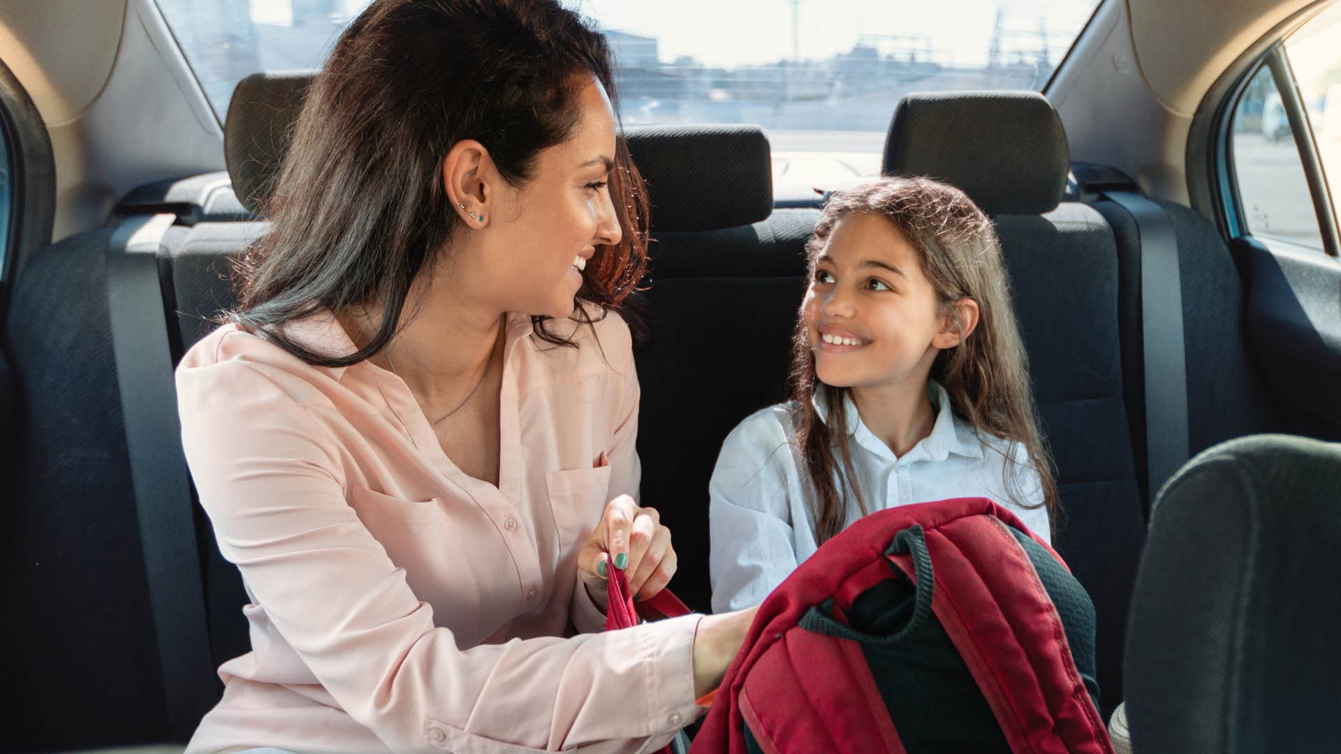 Mom sitting with daughter who will never hear ride in the back of the truck