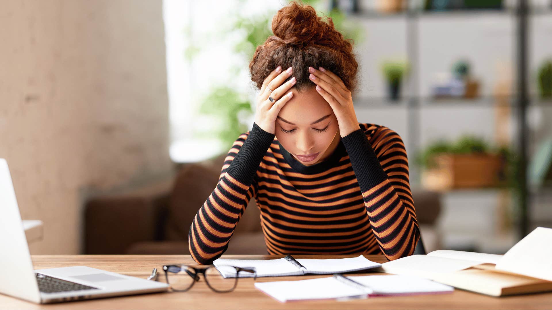 woman looking overwhelmed with work