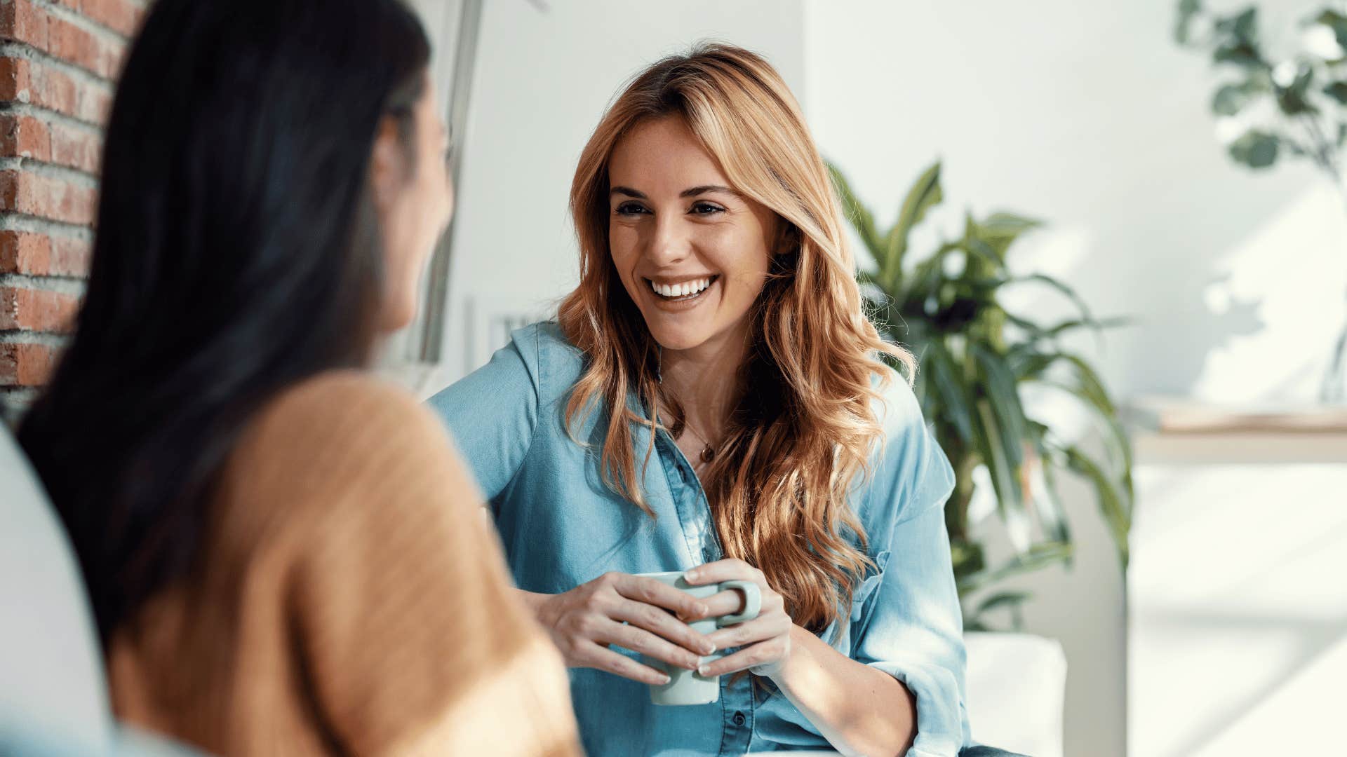 woman chatting with friend over coffee