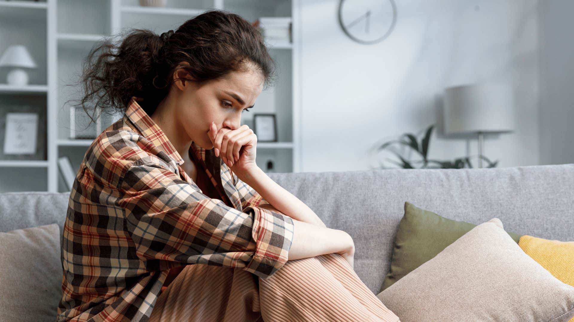 sad woman on couch