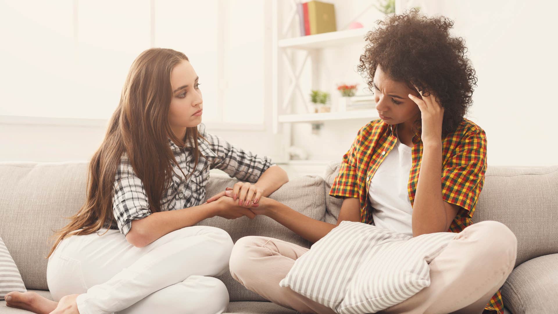 sad woman talking to friend