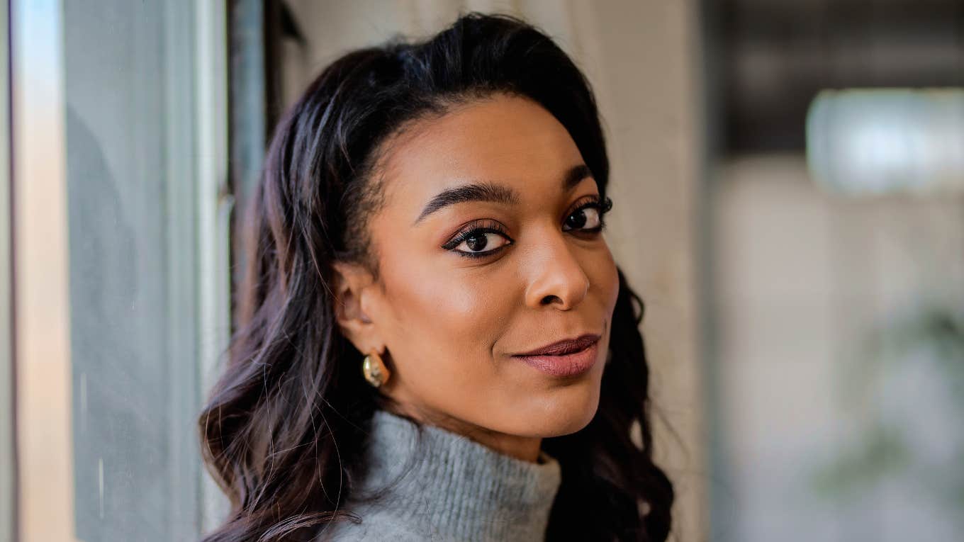 smiling woman wearing turtleneck