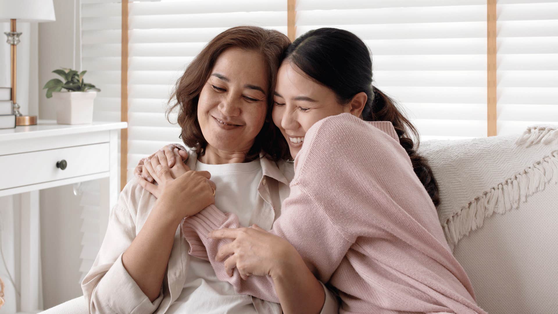 daughter hugging her mom