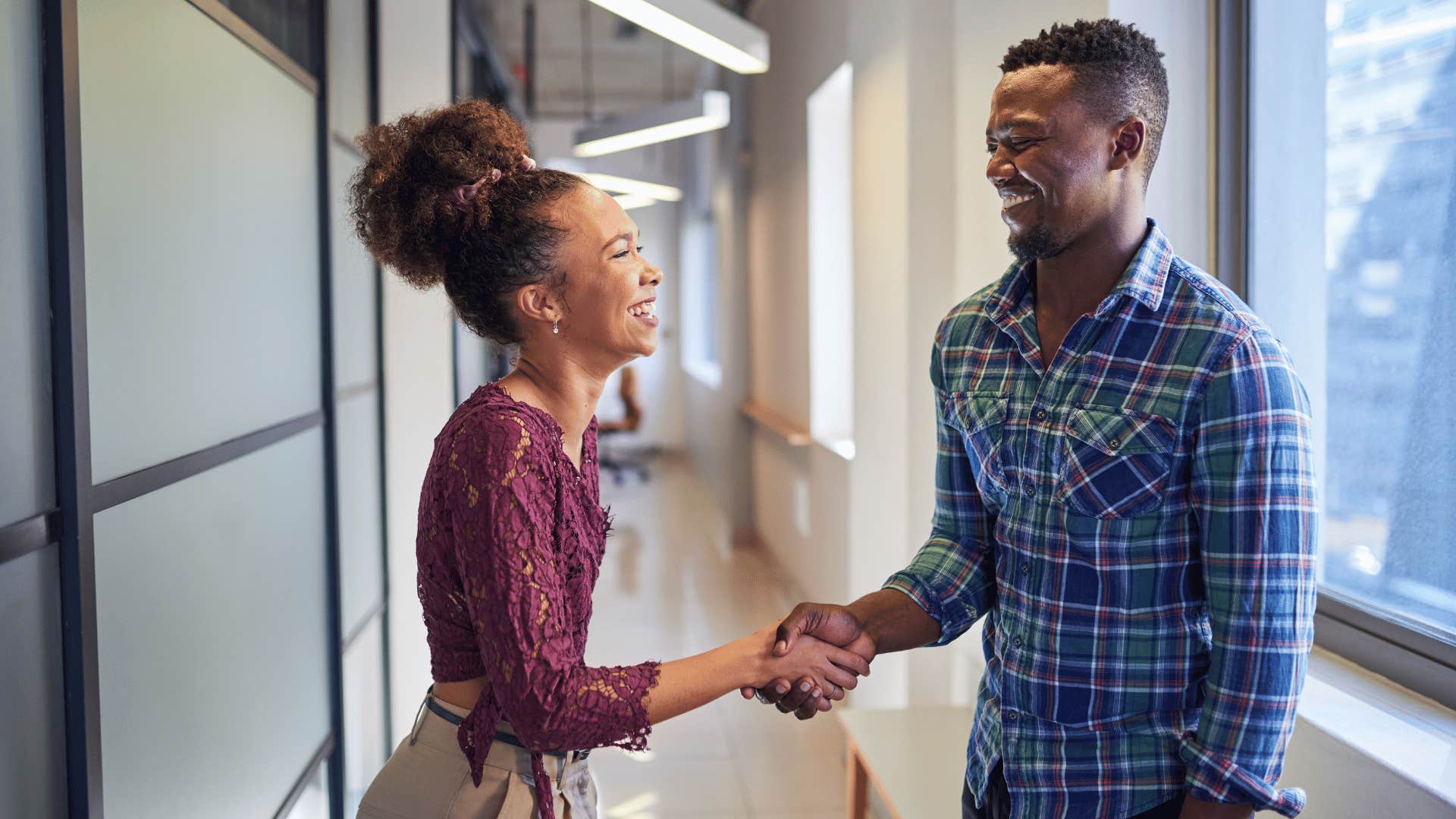 man and woman shaking hands