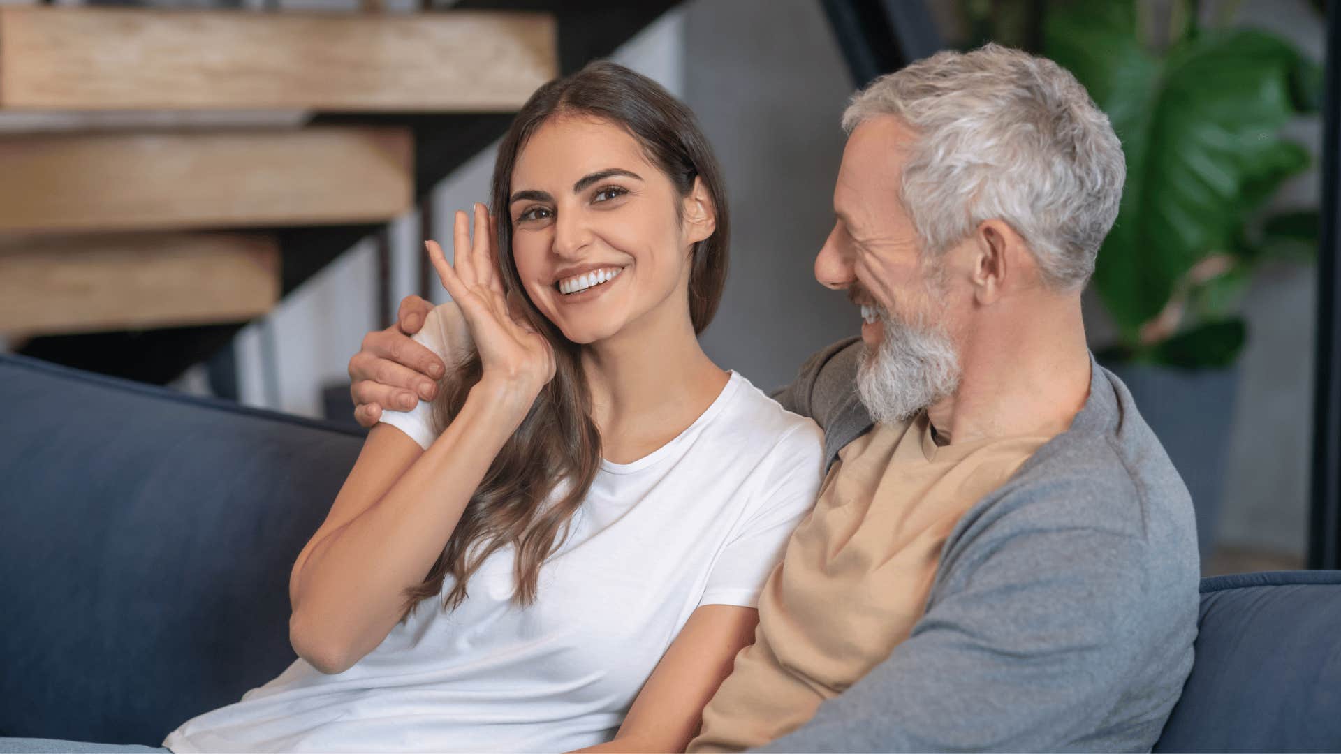 woman and man sitting on couch