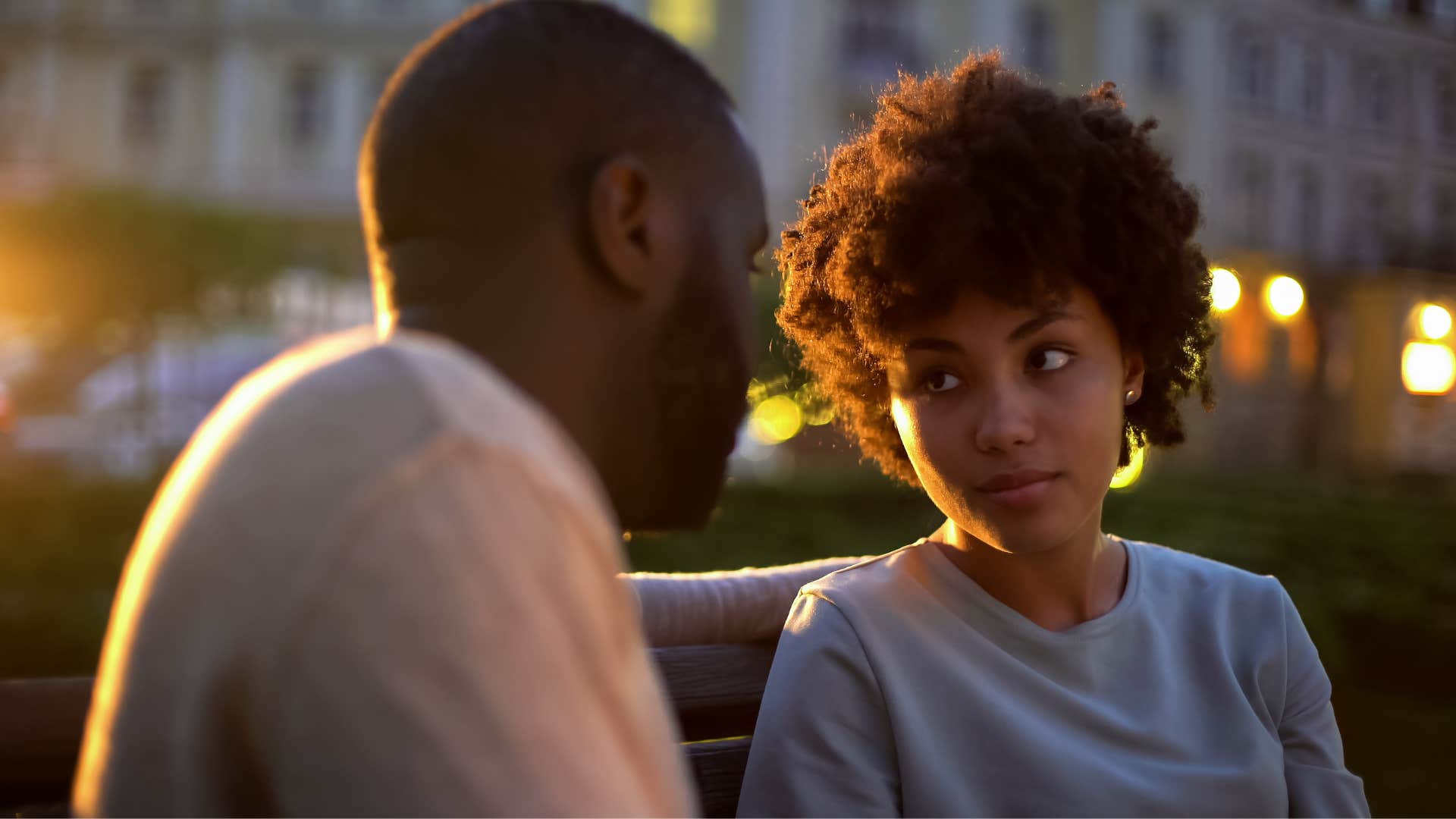 Woman looking at man saying she doesn't have future plans