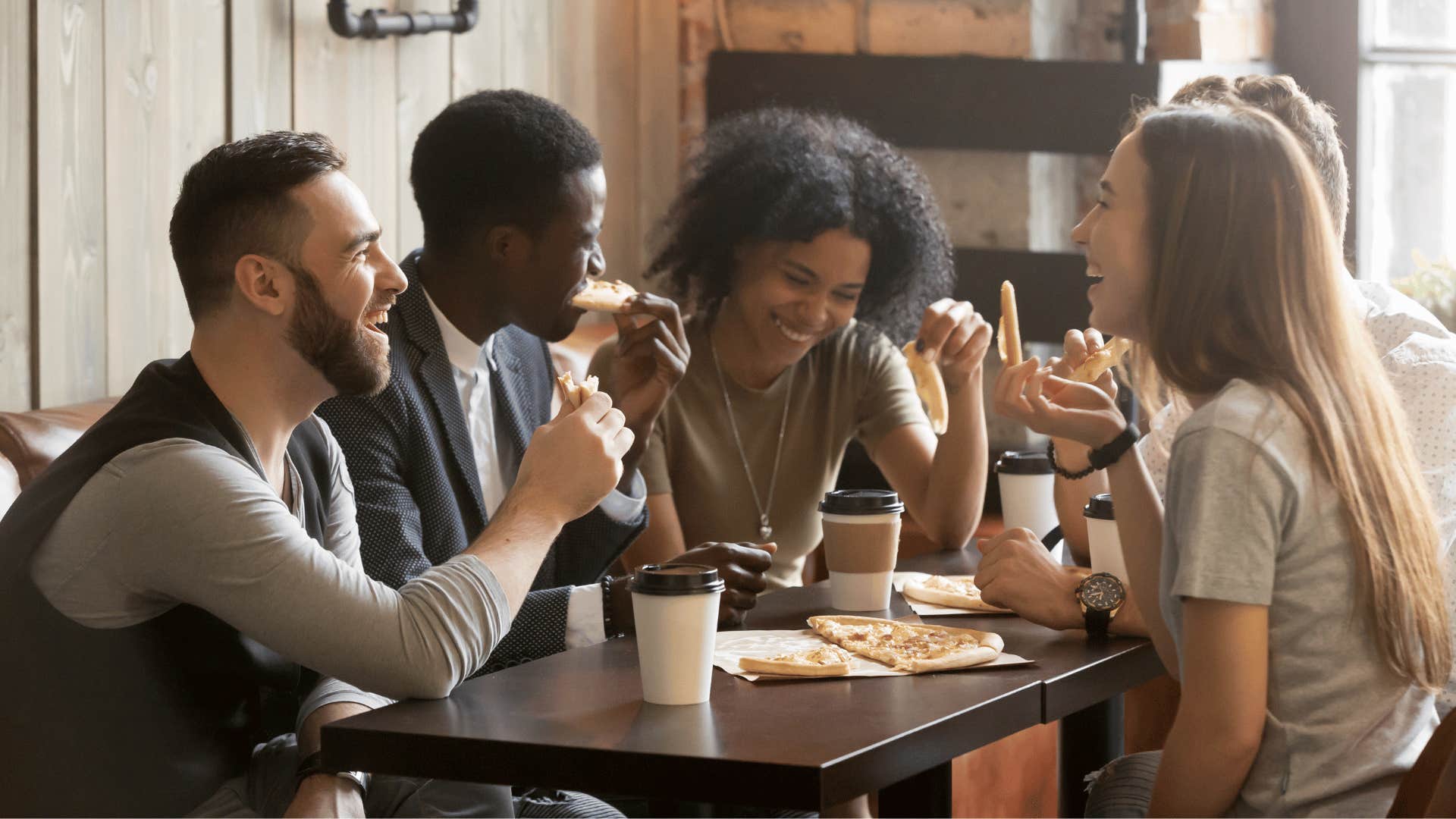 friends eating pizza together