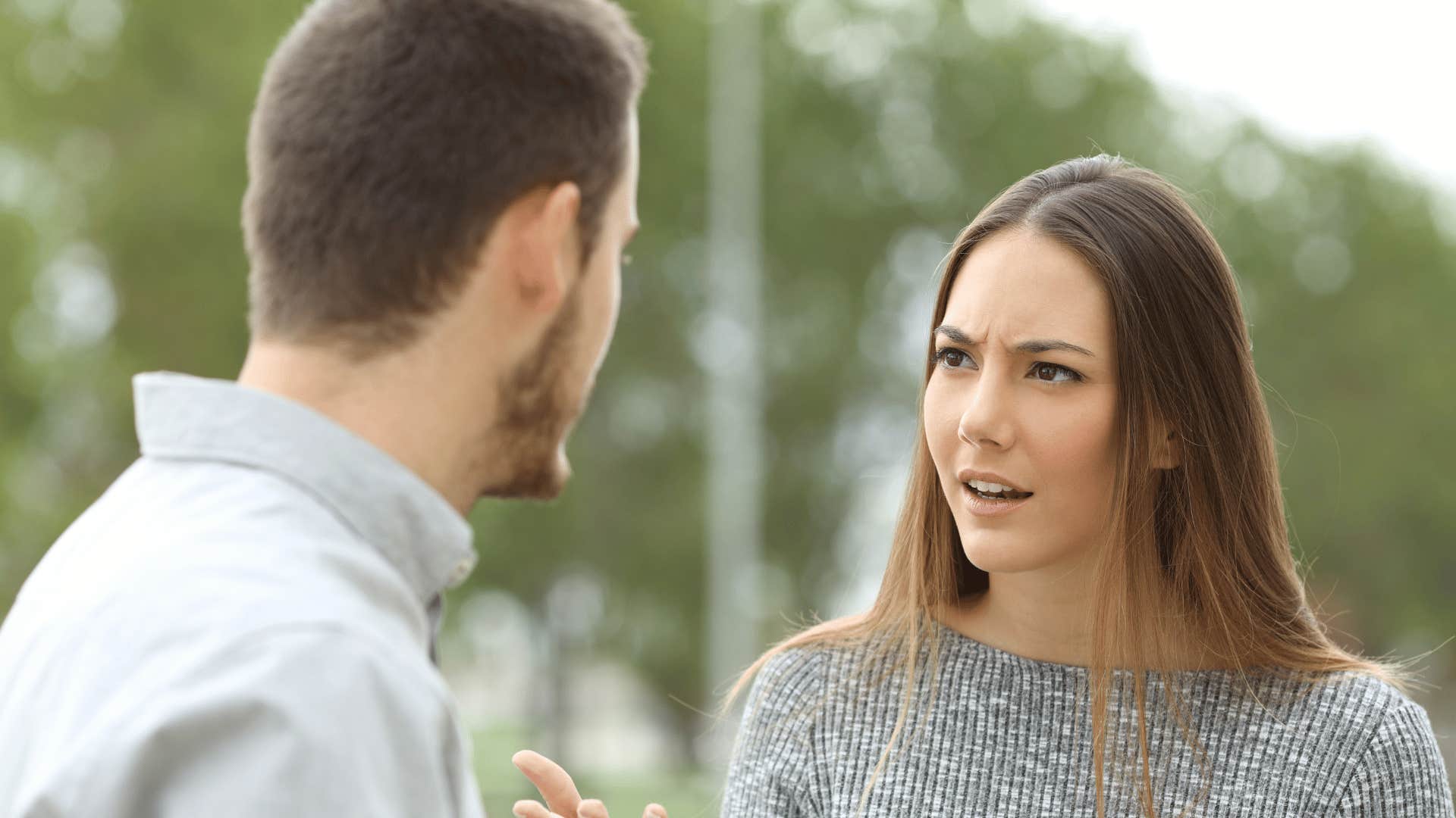 man and woman talking 