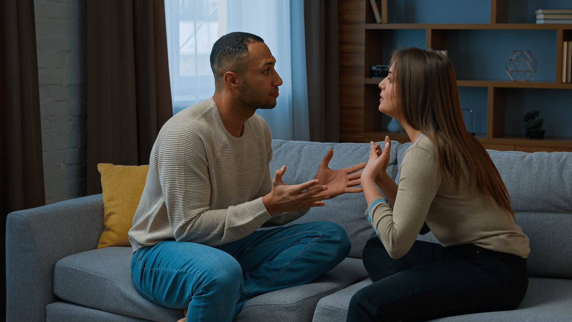 couple arguing on couch