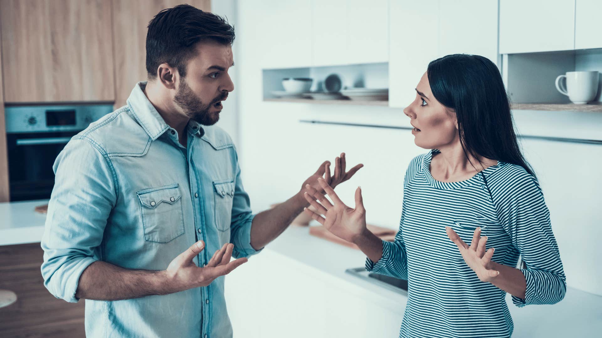 couple fighting in kitchen