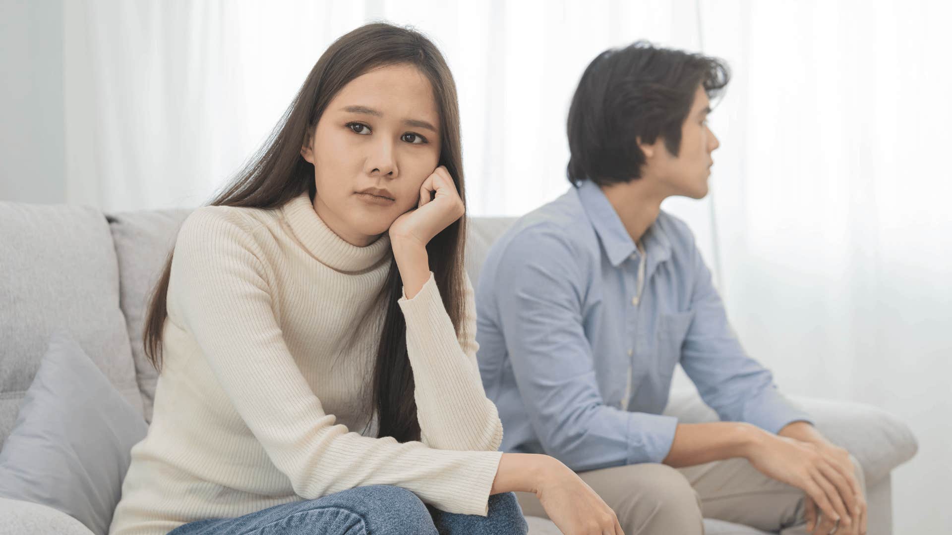 man and woman ignoring each other