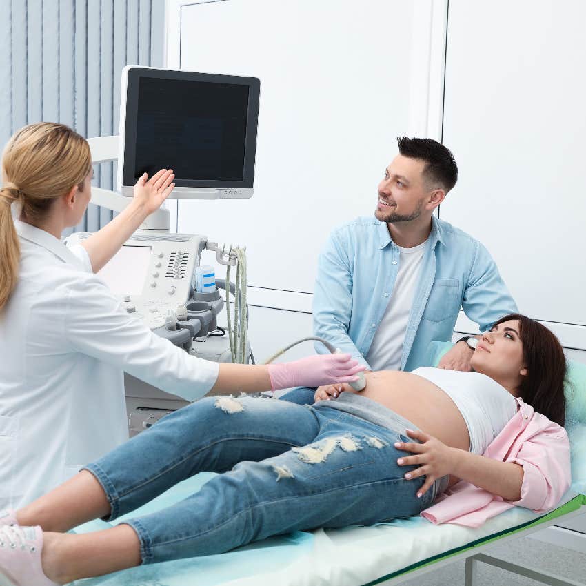 Pregnant couple at doctor appointment