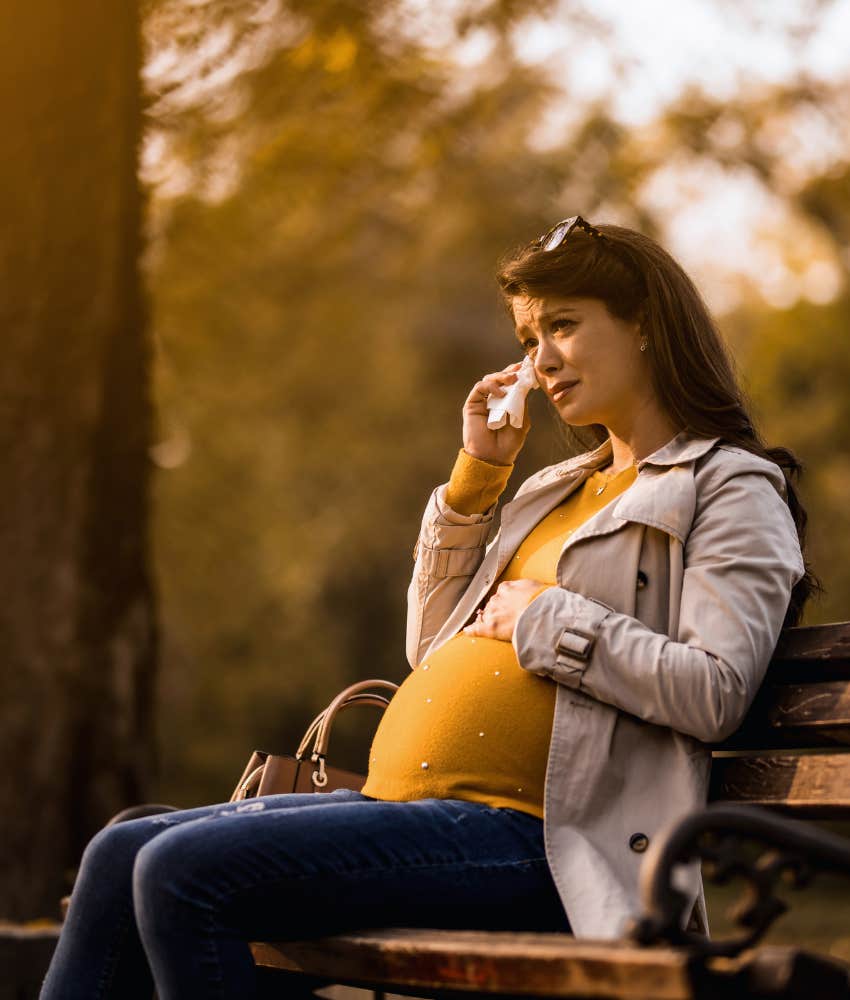 pregnant woman crying after death of husband