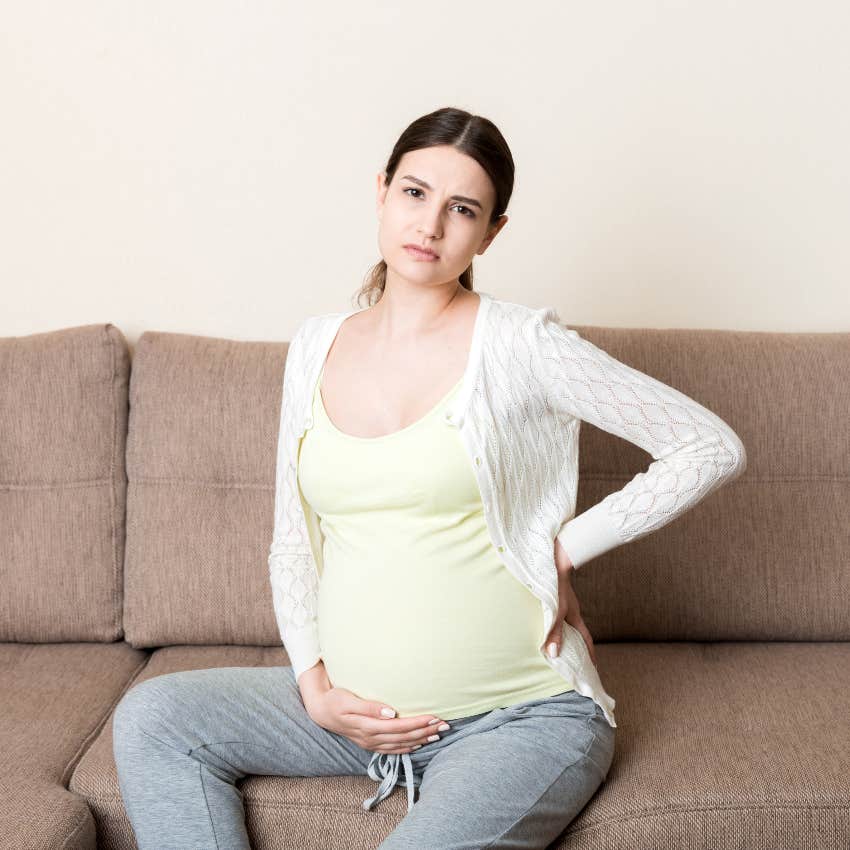 Pregnant woman who needs to sit down