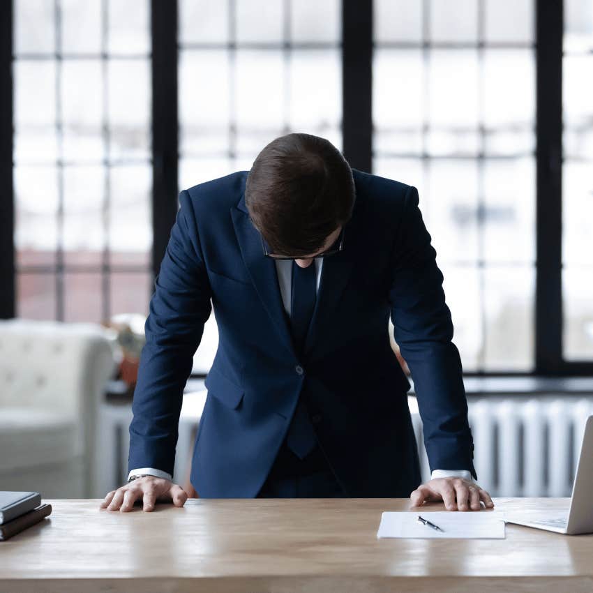 professional man hanging his head in despair