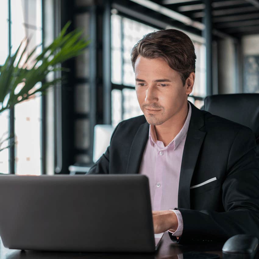 professional man typing on a laptop