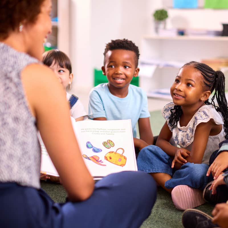 teacher reading to kids in class