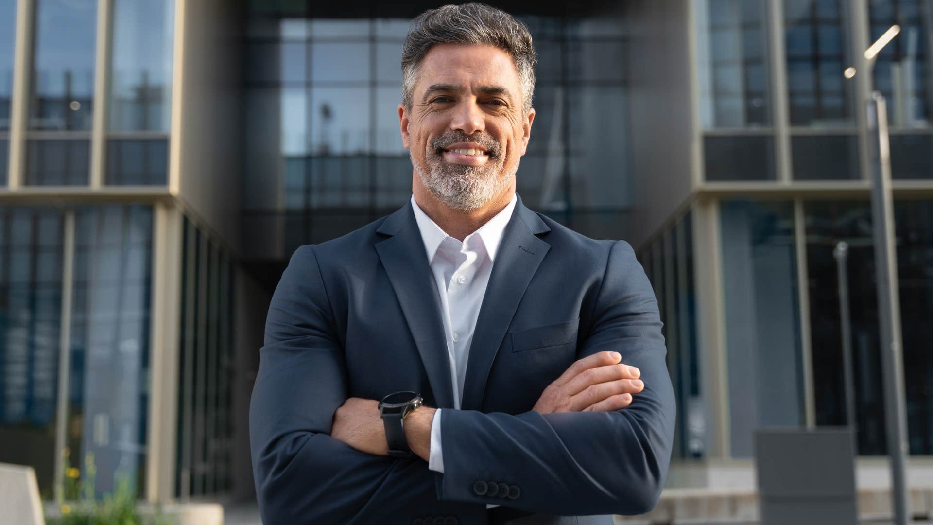 Confident man smiling in a suit. 