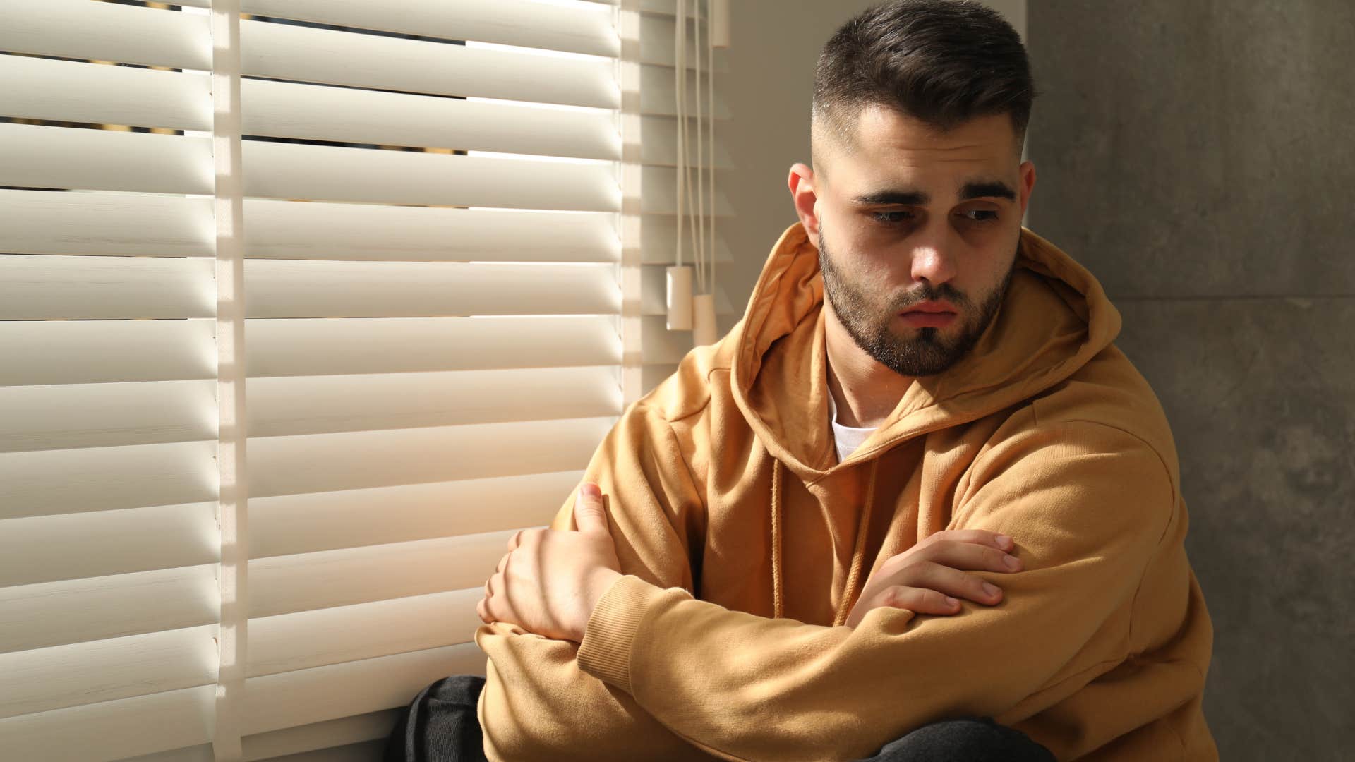 Lonely man self-isolating in his room. 