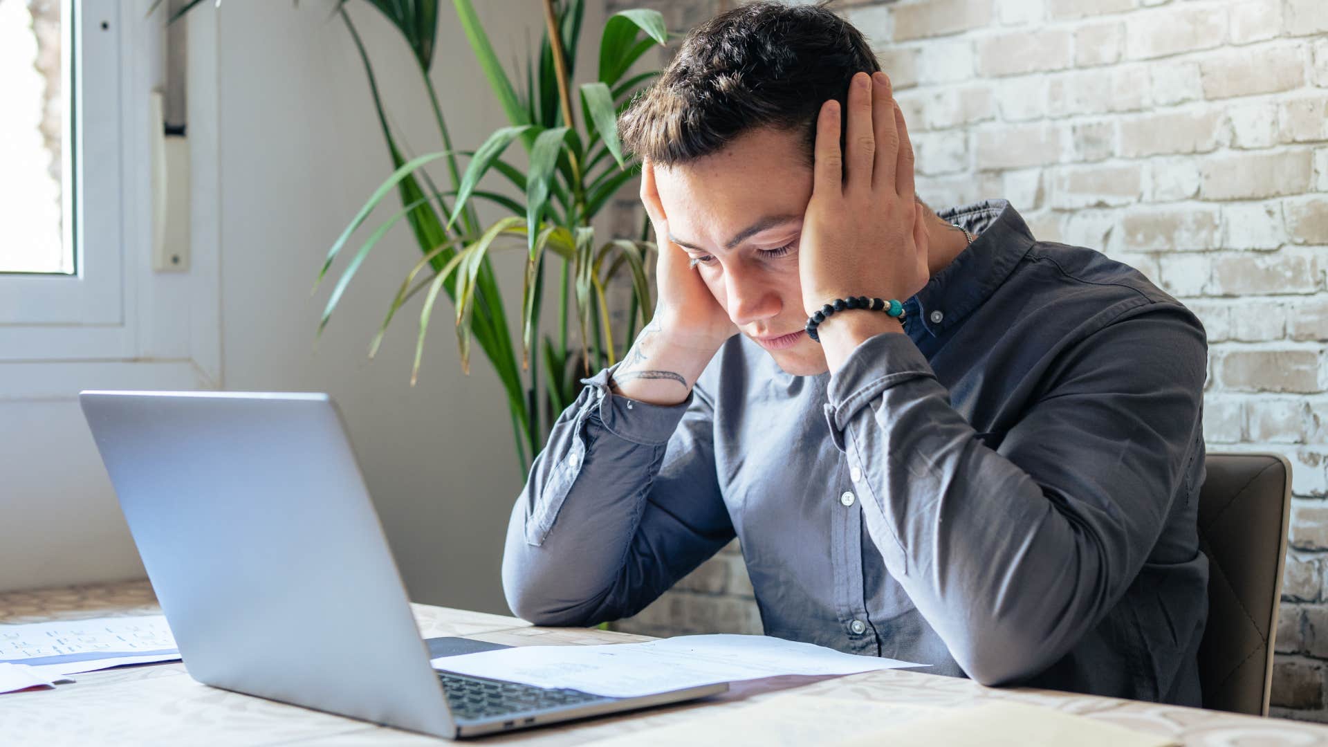 Man looking stressed at work.