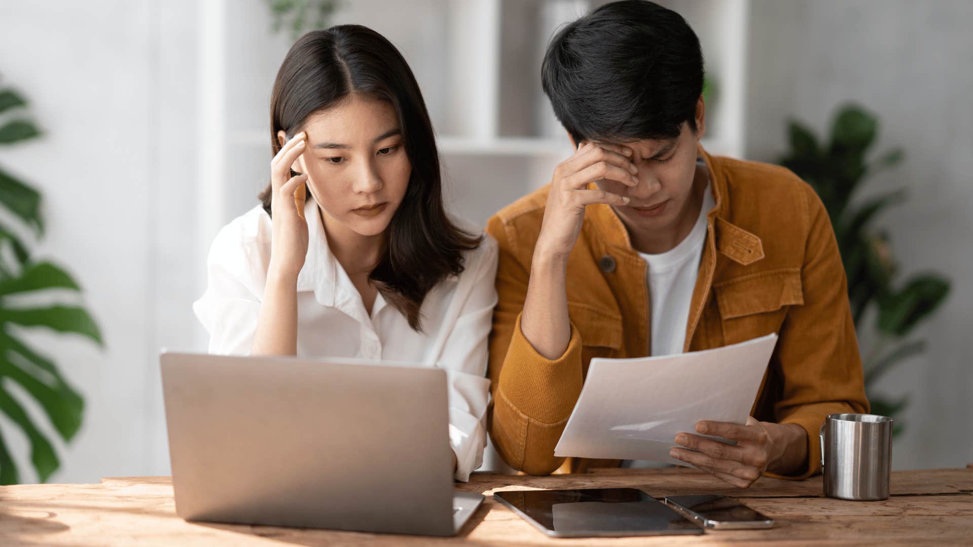 man and woman looking frustrated while working