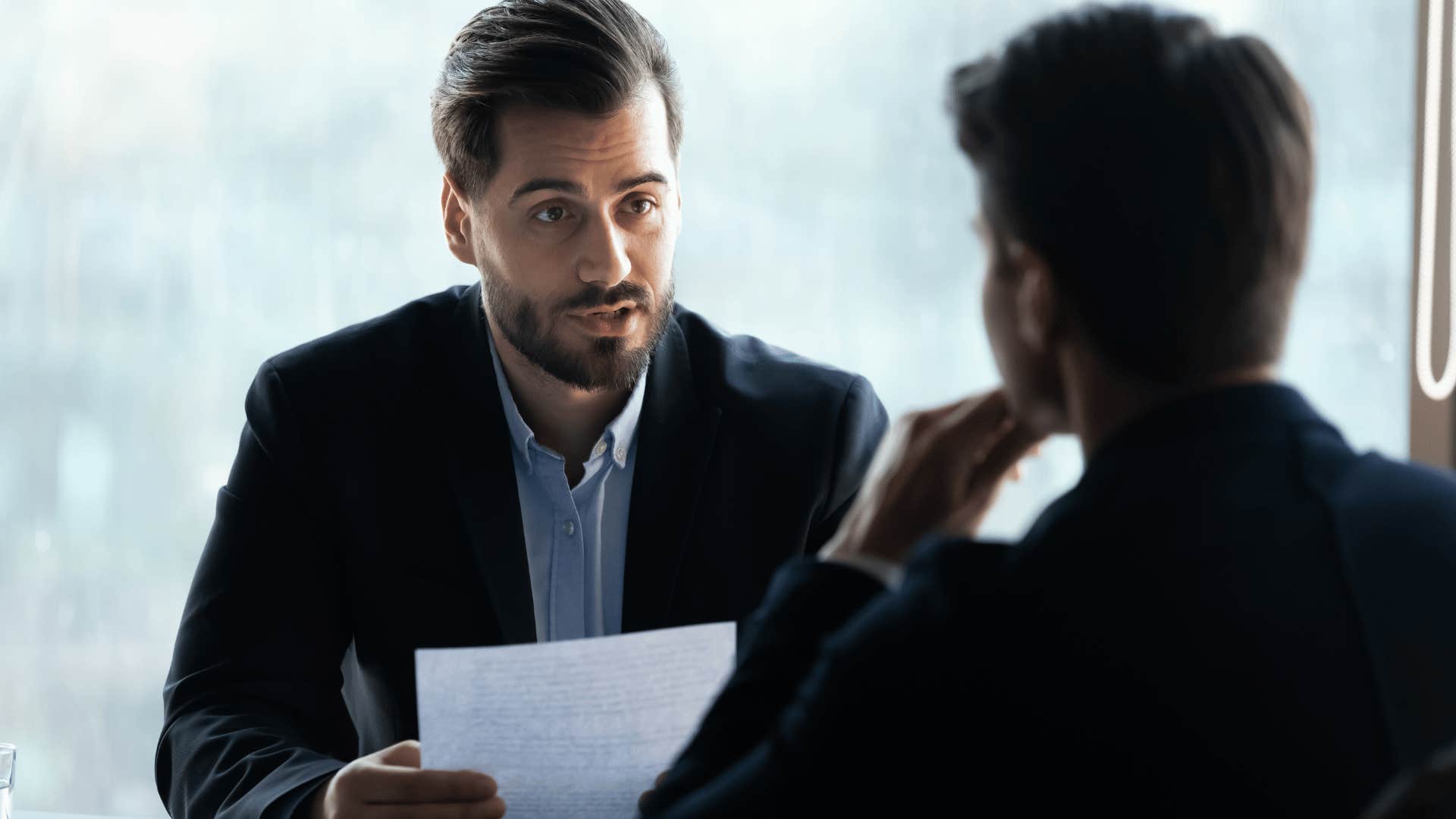 man going over document with other man