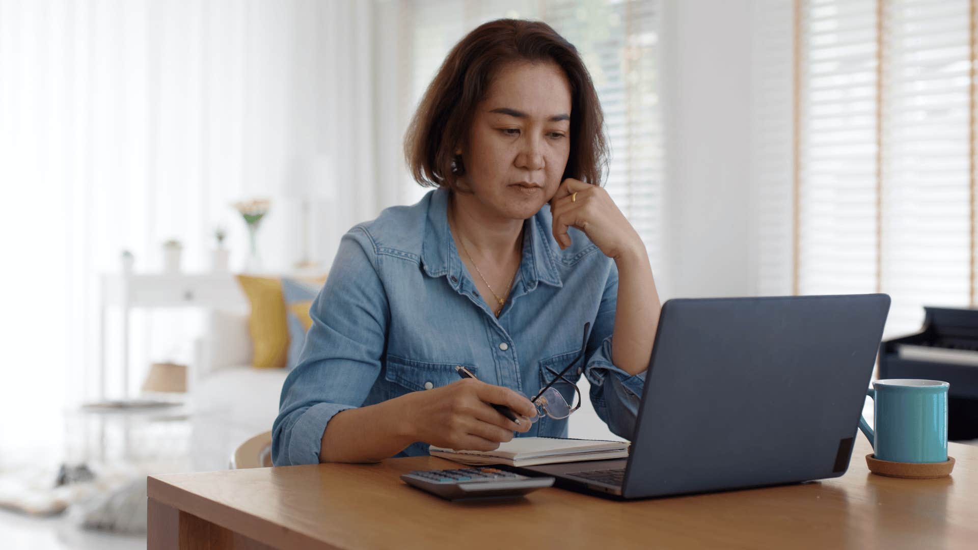 woman looking at laptop