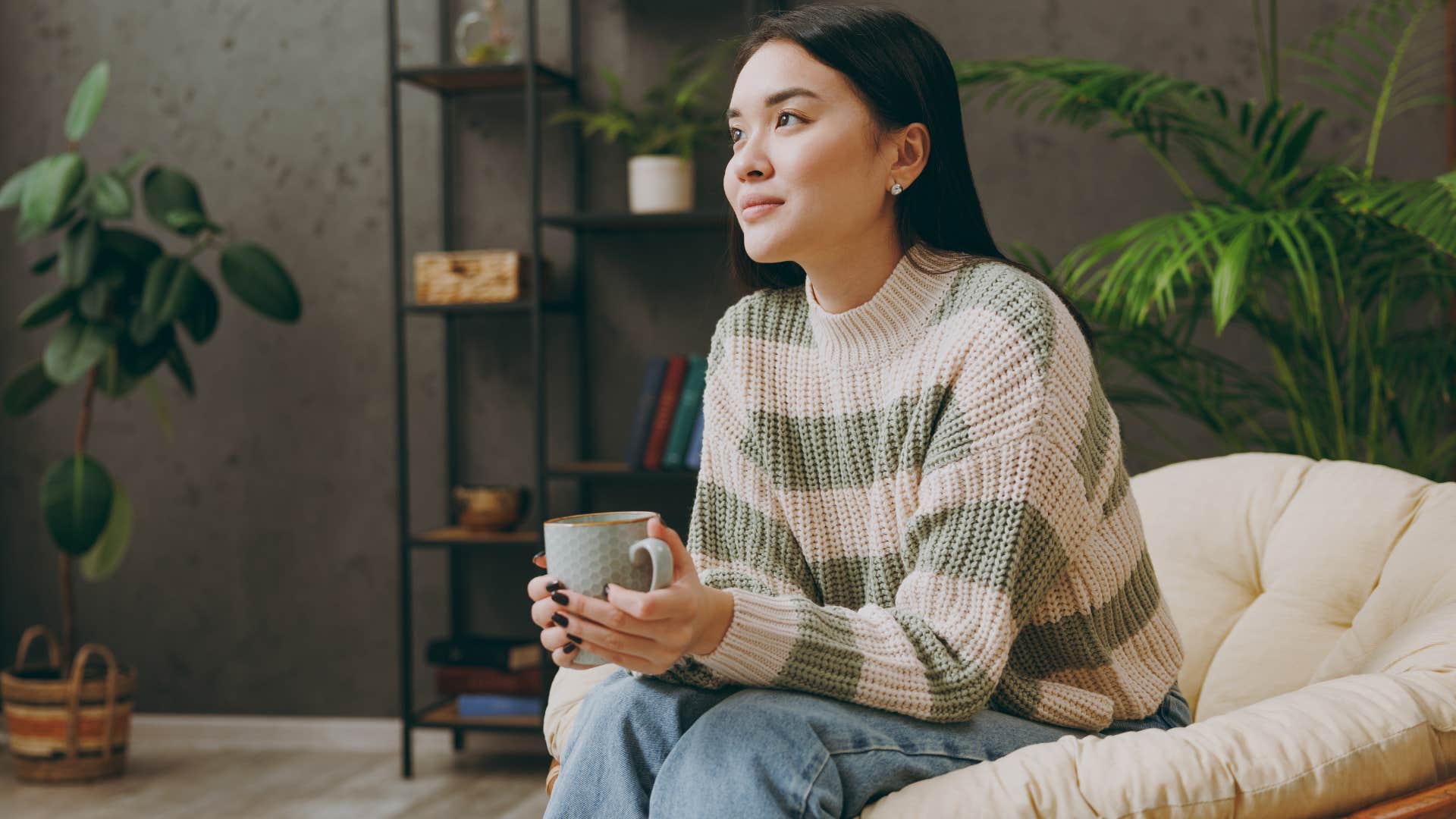 Woman looking relaxed drinking coffee at home.