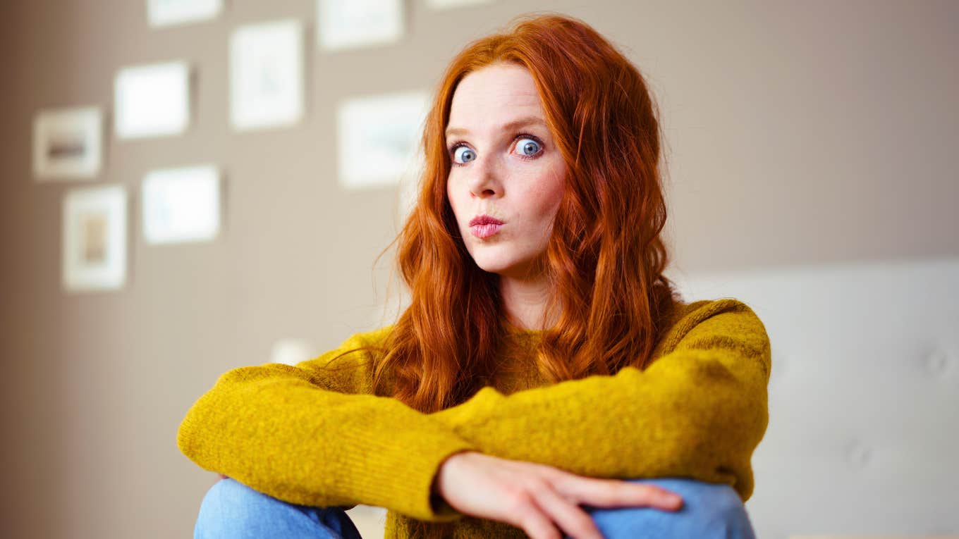 gen z young woman looking shocked