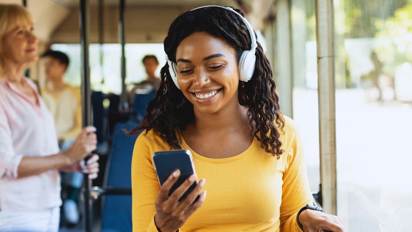 Woman is listening to the most relaxing song in the world.