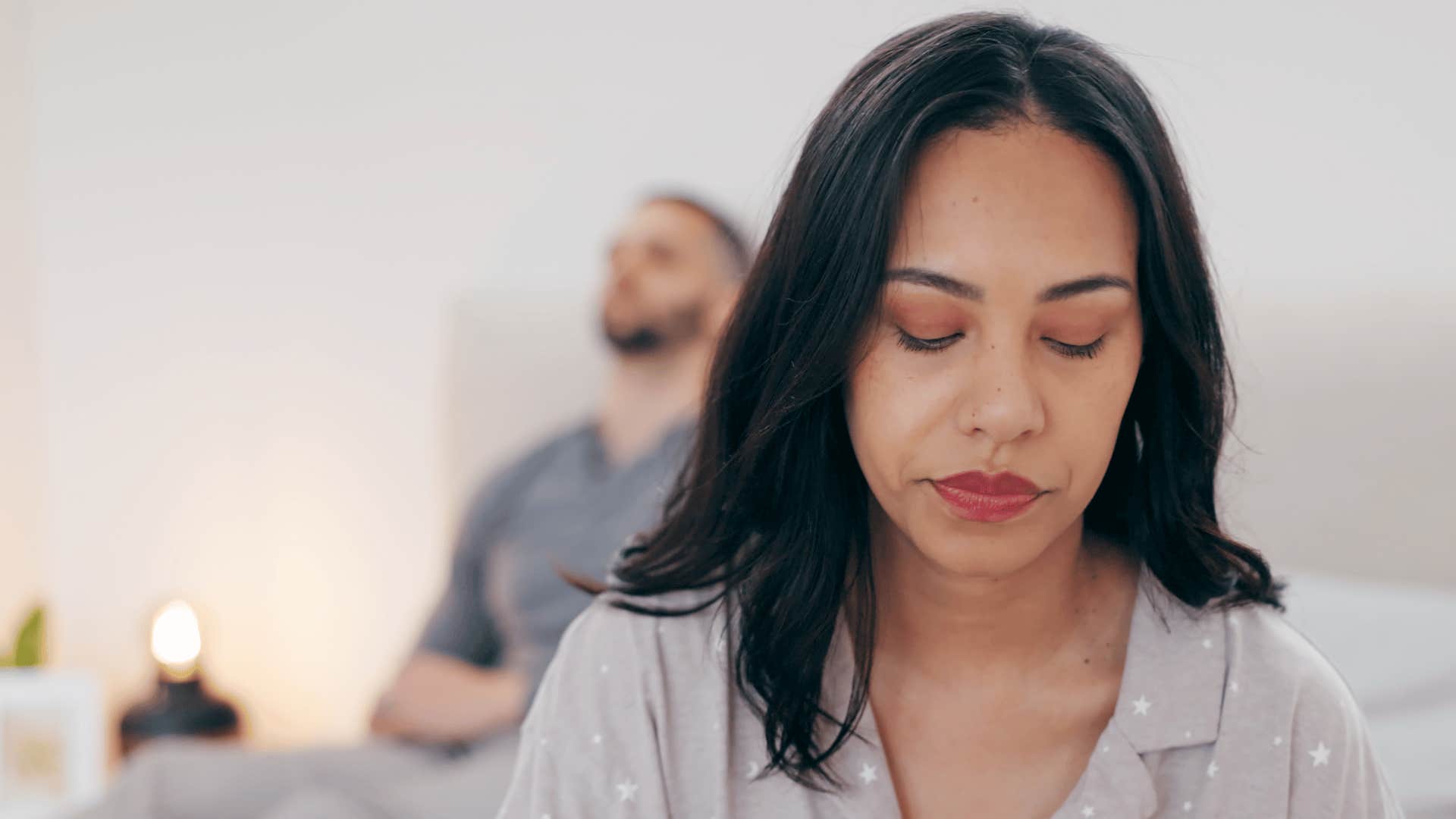 Woman and man are sad in bedroom