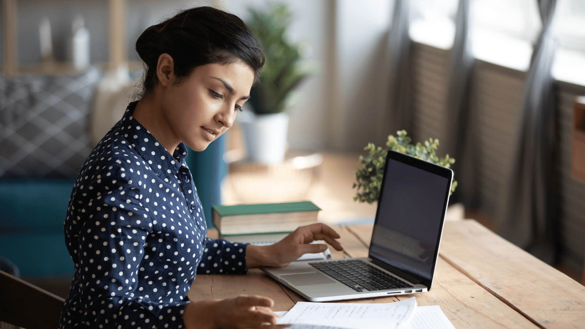 woman working hard and looking over notes 