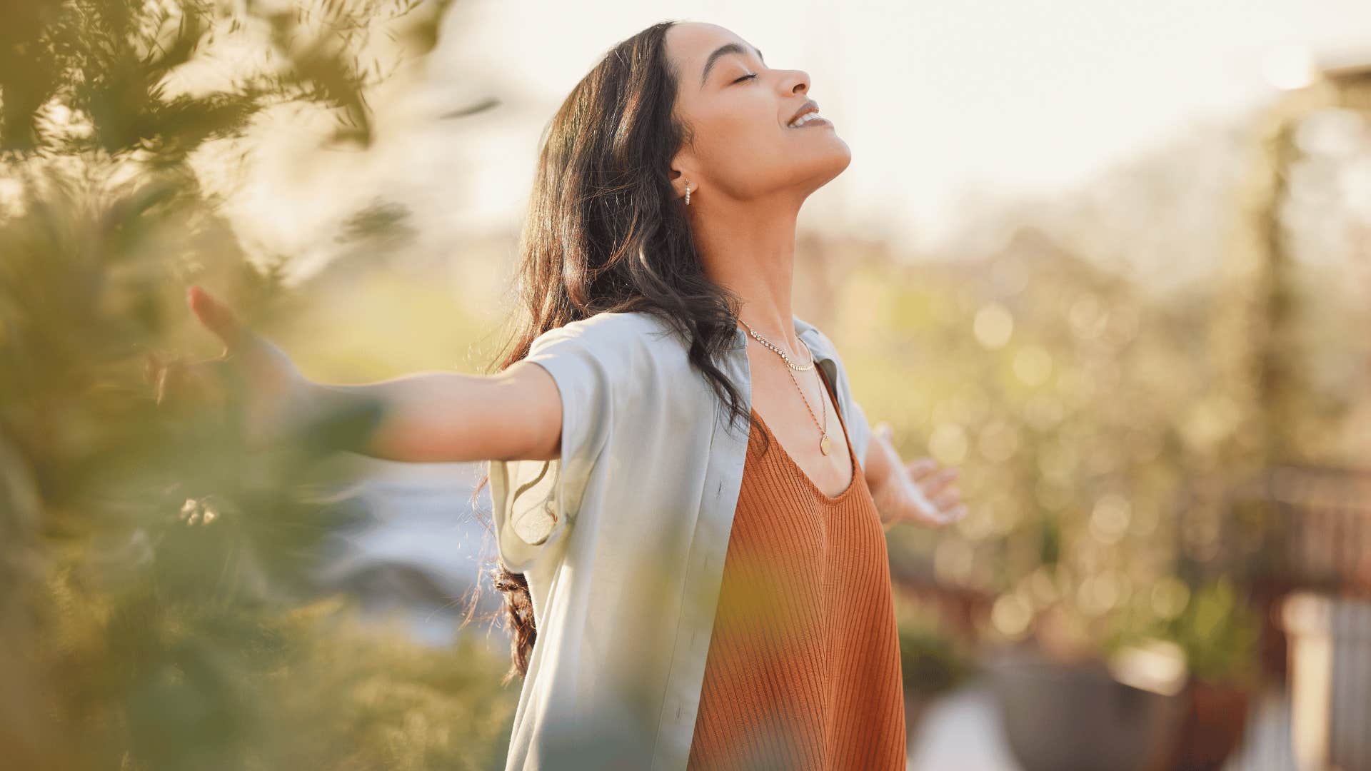 woman breathing in air outside 